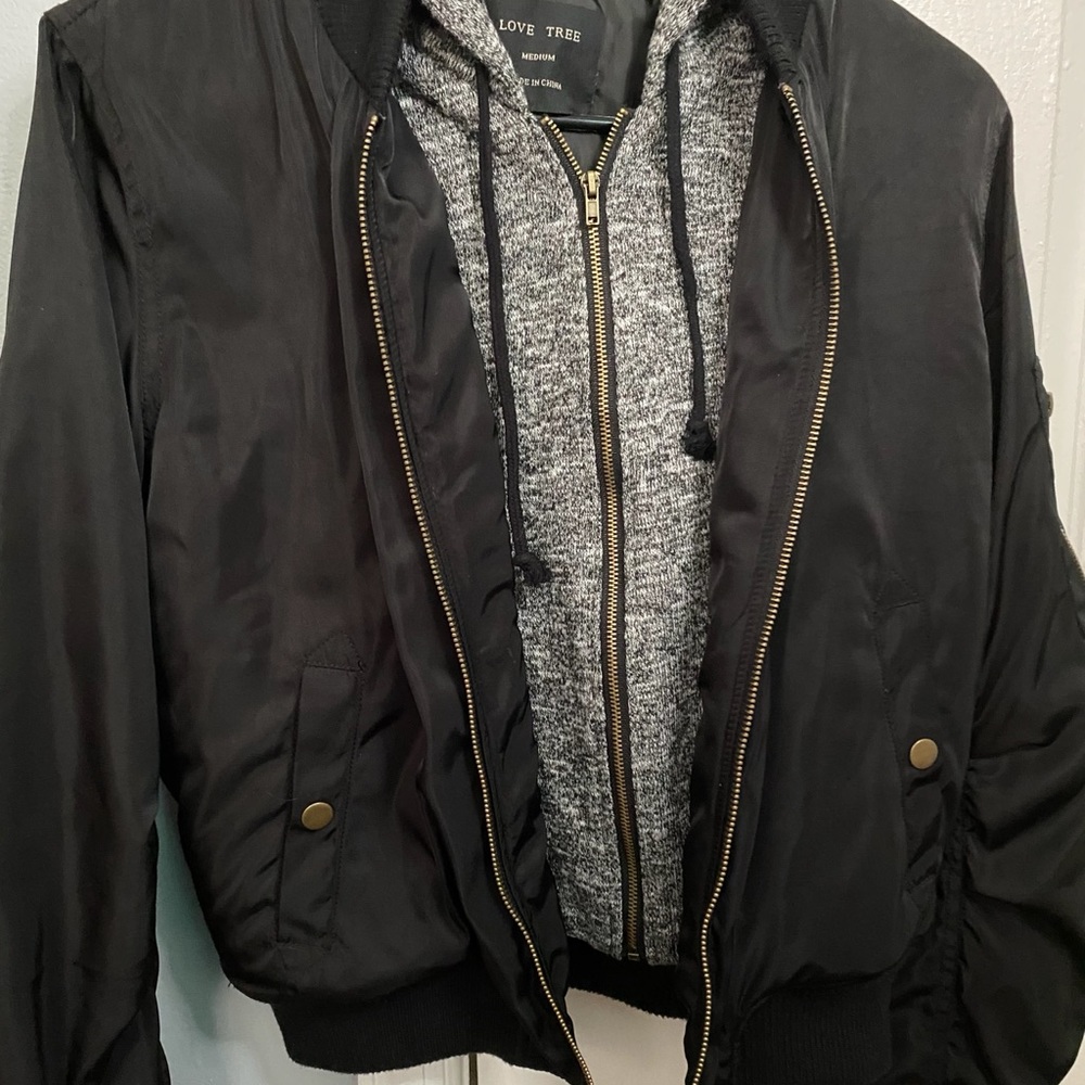 Black 2 layer jacket with hood.